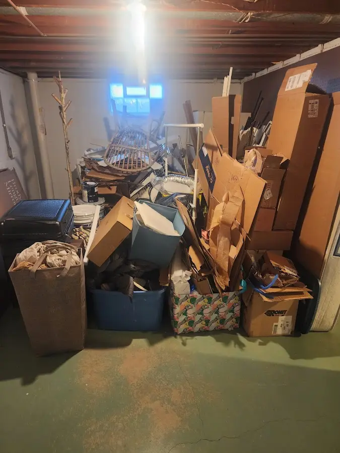 Roll-off dumpster container at job site for 15 Yard Dumpster Rental in Booneville